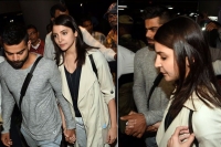 Virat answers cyber bullies holds anushka s hand as they leave airport