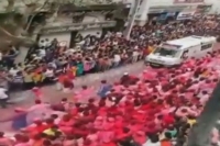 Devotees give way to ambulance during ganesh visarjan procession in pune
