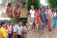 Ias officer s walk through mud in assam s flood affected district goes viral internet applauds