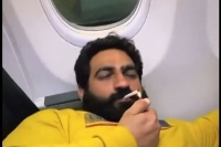 Booby kataria seen smoking inside the aircraft scindia vows strict action