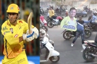 Csk fan stops traffic in pune with cut out of ms dhoni