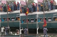 Viral video passengers dare ride on train s roof and a smooth way down
