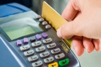 Government confident that debit card charges may decline