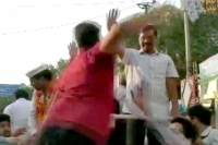 Delhi cm arvind kejriwal slapped by man during roadshow in delhi
