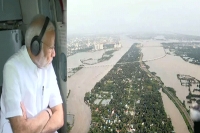 Pm surveys kerala floods grants rs 500 crore emergency aid