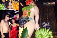 Australian bar criticized for using naked women as fruit trays