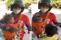 Zomato delivery partner carries his kids to work internet calls him real hero