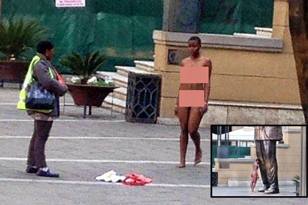 Young lady gets naked at nelson mandela statue