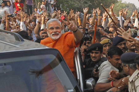 narendra modi set for record hat-trick in gujarat, congress far behind