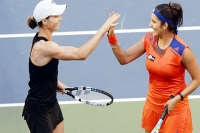 Sania mirza cara black won the pan pacific open tennis match against casery dellacqua and lisa reymand