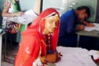 Girl attends to exams in bridal dress