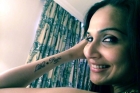 Soundarya rajinikanth tattooed parents name