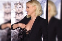 Charlize theron s red carpet nip slip