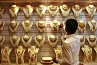 Gold halts 4 day falling streak rebounds rs 120 on global cues