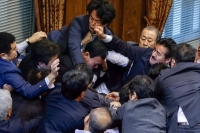 Japan military bills provoke scuffling in parliament
