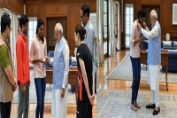 Pm narendra modi meets pv sindhu after her historic triumph