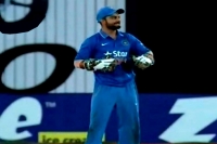 Virat kohli keeps wickets to give ms dhoni a one over break