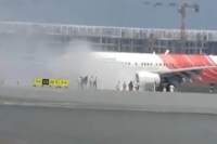 Ai express flight to kochi evacuated after engine catches fire on taxiway in muscat