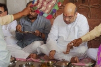 Amit shah dines with dalits at varanasi village