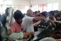 Kurnool official abuses slaps people in queue in anna canteen