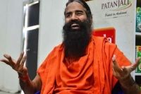 Ramdev again questions covid 19 vaccines says he s protected by yoga ayurveda