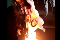 Balakrishna effigy flexi set on fire by his fans