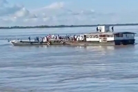 Dozens feared missing as two passenger ferries collide on brahmaputra in assam