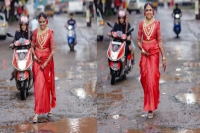 A wedding photoshoot like no other kerala bride poses on road full of potholes