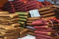 Ec orders telangana goverment not to distributes free bathukamma sarees
