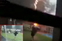 Terrifying moment child is almost hit by a huge lightning bolt