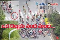 Careless jaywalker causes mass pile up in china cycle race