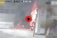 Man sets bike on fire at gas station china