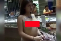 Saleswoman is forced to strip down to sell diamonds at a popular jewellery store in china