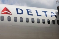 Man charged with kicking yelling racist comments at muslim delta employee at jfk