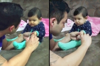 Baby fake cry while dad tries to cut nails
