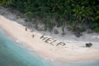 Stranded sailors rescued from pacific island after building help sign on sand