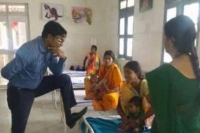 Chhattisgarh ias officer puts feet on a patients bed apologises