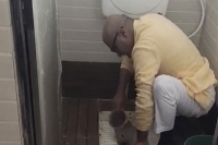 Viral video madhya pradesh bjp mp janardan mishra cleans school toilet with bare hands