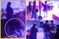 Bengaluru youth apologizes his girl friend by touching her feet