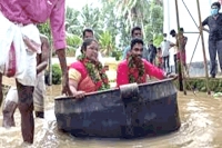 Kerala couple sails in a cooking vessel to get married amid nature s fury