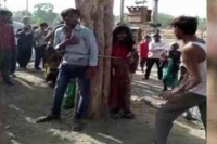 Mp man elopes with married woman is tied to tree and thrashed