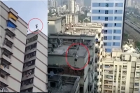 Watch man jumps from one terrace to another in mumbai s parel area