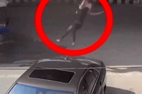 Woman on bike miraculously survives after being thrown off flyover