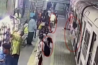 Viral video woman falls off moving train in mumbai saved by alert guard