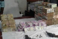 Odisha police seize cash including new currency in sambalpur