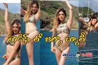 Parvathy melton flaunts in two piece bikini