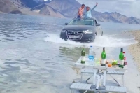 Twitter blasts tourists who drove their audi through ladakh s pangong lake video goes viral