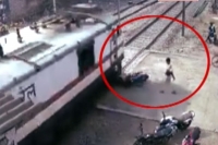 Train hits bike at thadithota railway gate in rajahmundry