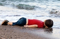 The tiny child is thought to be part of a group of 11 syrians who drowned off the coastal town of bodrum in turkey