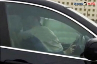 Motorist captures couple romance while driving